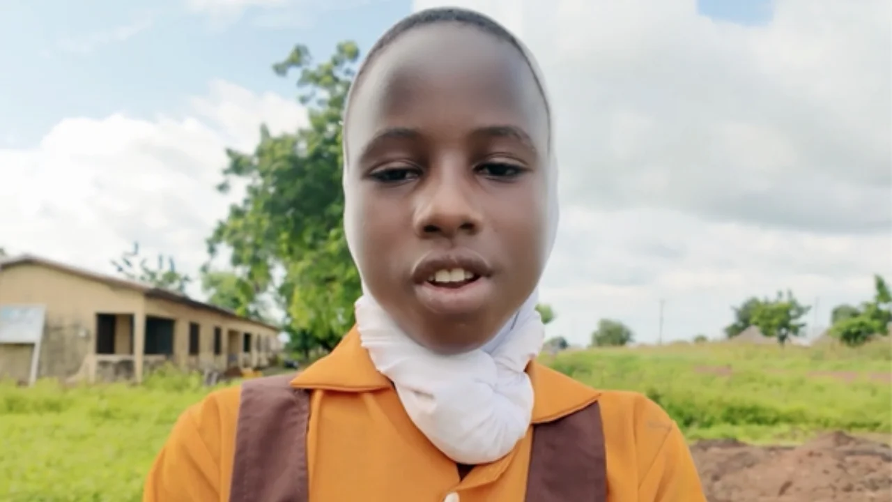 Photo: Amina 16, as she shows us her community